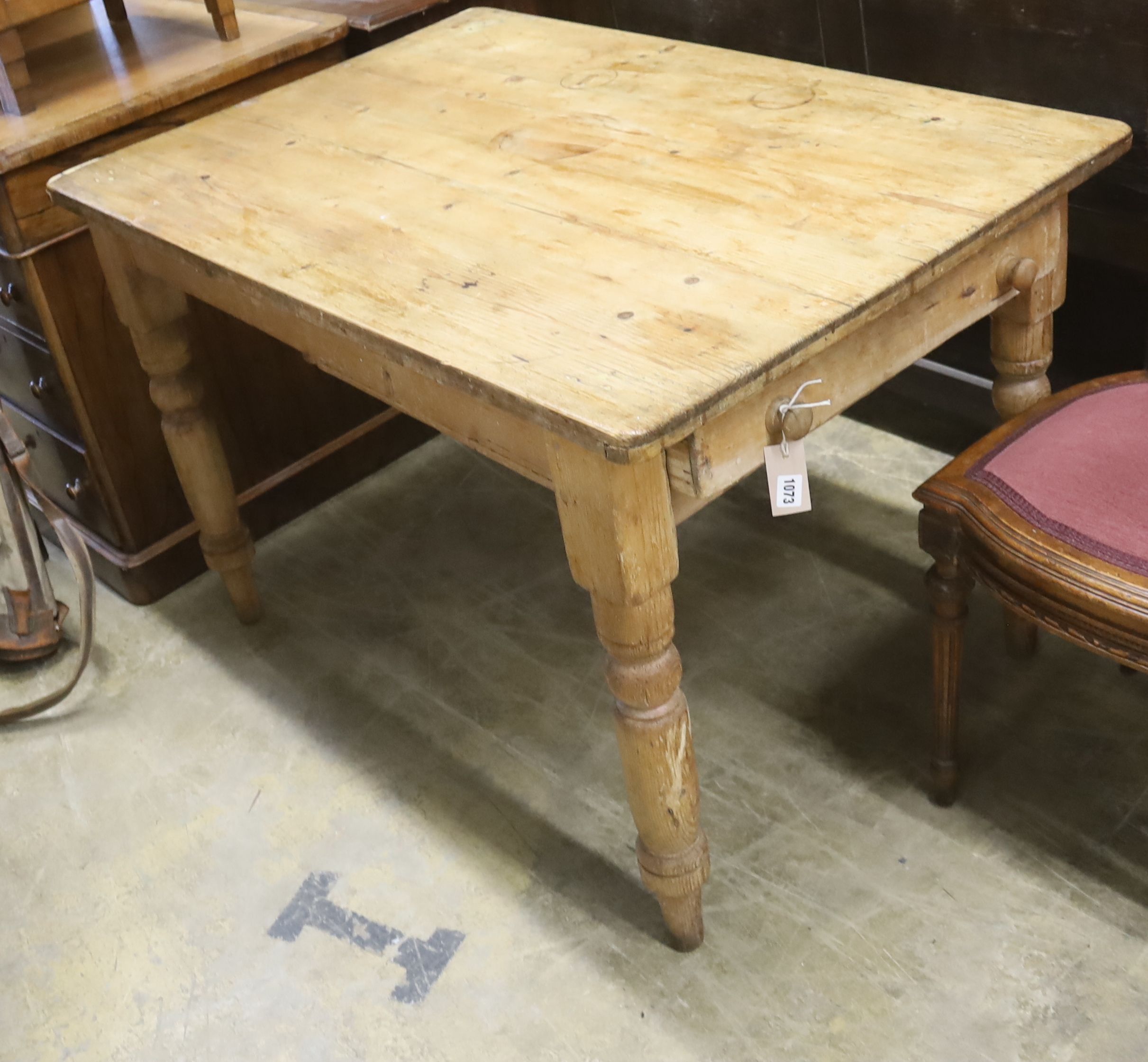 A rectangular pine kitchen table, length 112cm, depth 75cm, height 72cm